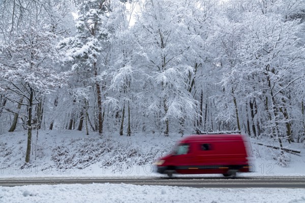Delivery truck drives through snowy landscape, trees, winter, snow, Sieversen, Samtgemeinde Rosengarten, Lower Saxony, Germany
