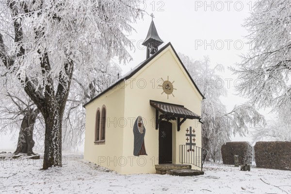 Schoenstatt Chapel Ennabeuren with hoarfrost in winter. Tourist attraction in the Swabian Jura. Heroldstatt, Baden-Württemberg, Germany