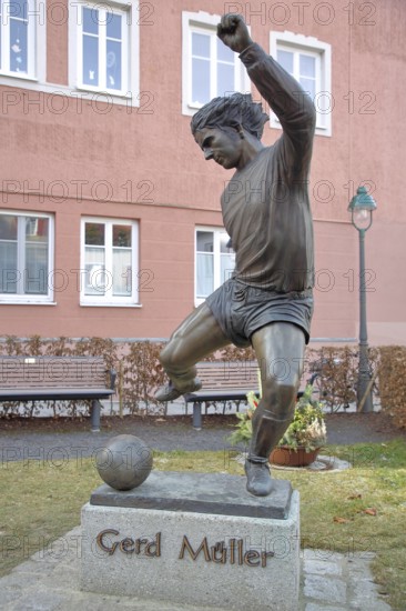 Memorial to soccer player Gerd Müller, German national team player, soccer legend, bronze sculpture, inscription, Gerd-Müller-Platz, Nördlingen, Bavaria, Germany