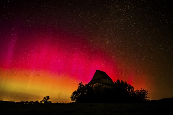 Colourful polar lights over the EXPO observatory in front of a starry night, EXPO Observatory, Oberholsten, Melle, Lower Saxony, Germany