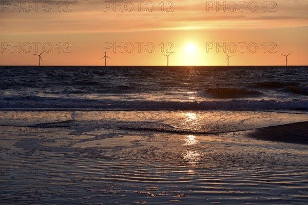Sunset behind wind turbines in the Danish North Sea