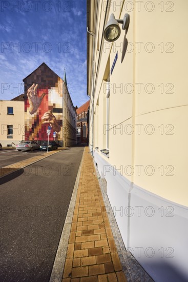 Residential buildings, apartment buildings, modern façade painting, brick sidewalk, asphalt road, parking lot with cars, blue sky, altocumulus clouds, Domstraße, Schwerin, state capital, district-free city, Mecklenburg-Western Pomerania, Germany