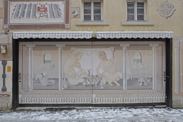 Historical wall by artist group Kollektiv K 2020, historical paintings on the history of the city, contemporary history, house façade, street art, mural, Roman period, Romans with chess set, eels, Swabian Jura, Baden-Württemberg, Germany