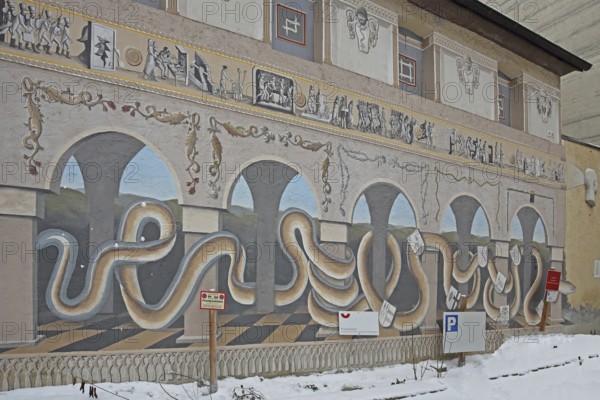 Historical wall by artist group Kollektiv K 2020, wall painting with historical city history, large snakes on the colonnade, arcade, giant snake, snake figure, mural, street art, contemporary history, house façade, eels, Swabian Jura, Baden-Württemberg, Germany