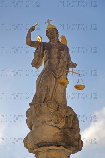 Justice as an angel and golden crown with cross and beam scale, golden wings, symbol of justice and law, stone sculpture, cutout, courtyard, Benedictine monastery, Neresheim, Härtsfeld, Swabian Jura, Baden-Württemberg, Germany