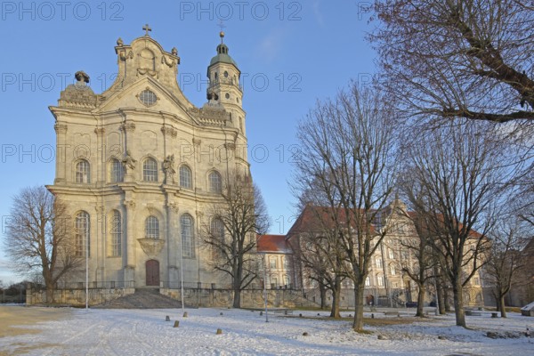 Late Baroque monastery church with snow in winter, Benedictine monastery, Neresheim, Härtsfeld, Swabian Jura, Baden-Württemberg, Germany