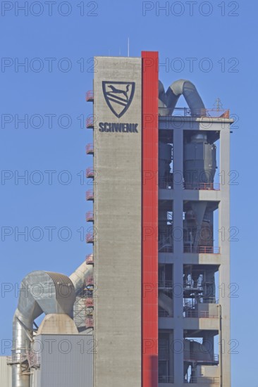 Silo with inscription and emblem of Zementfabrik Schwenk Manufacture of cement, tower with pipes, industrial plant, cement plant, Mergelstetten, Heidenheim an der Brenz, Swabian Alb, Baden-Württemberg, Germany