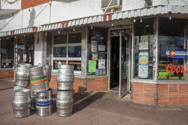 Arvada, Colorado - Empty beer kegs stacked outside Cheapskates sports bar in Olde Town Arvada