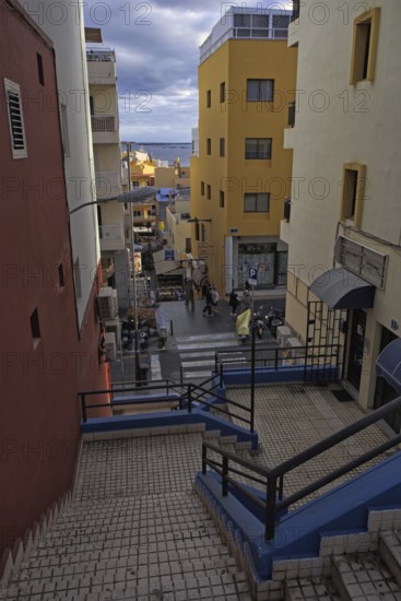 Urban scene with colorful buildings, stairs and views of the sea, Los Cristianos, Tenerife