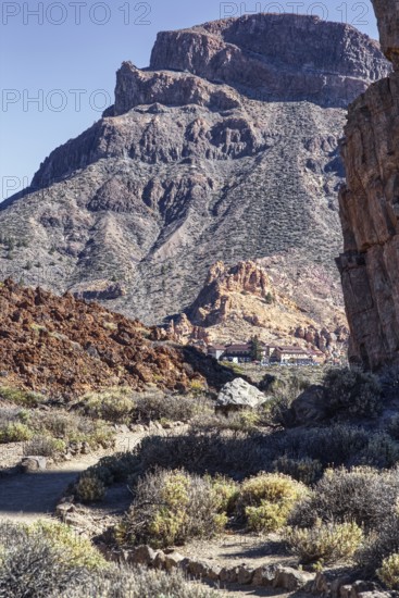 Steep mountain scenery with sparse vegetation in a dry landscape, Pico del Teide National Park, La Orotava Tenerife