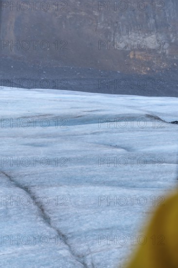 Athabasca glacier in jasper national park, alberta, canada, showing the effects of climate change with visible melting and crevasses forming on the ice surface