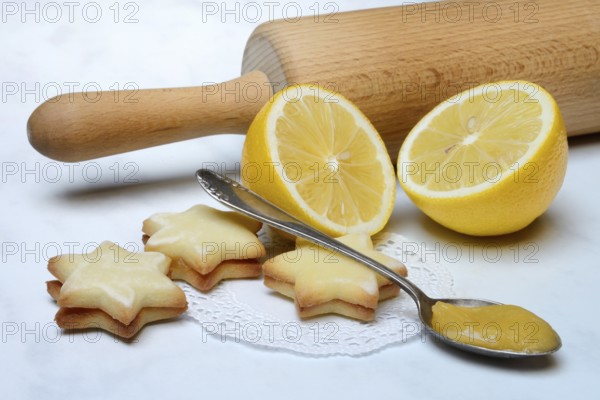 Lemon cookies, lemon and spoon with lemon curd