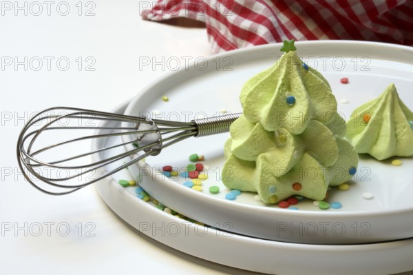 Meringue in the shape of a Christmas tree and whisk, Christmas cookies, meringue