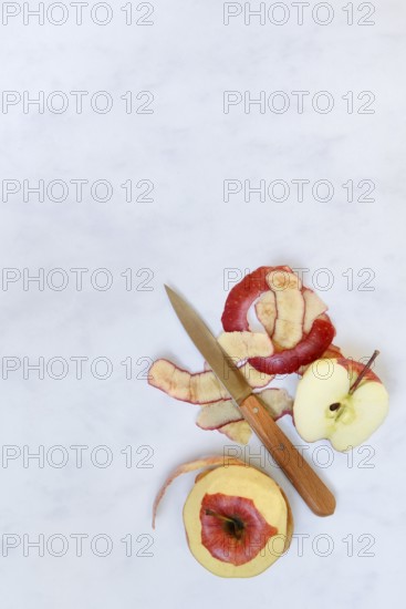 Peel apples with a knife, apple peels