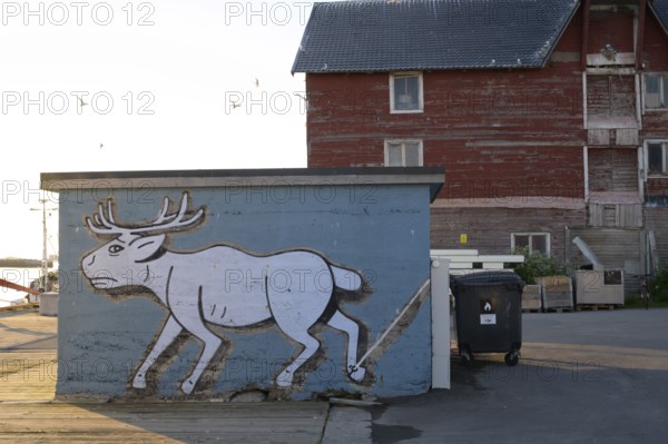 Mural depicting a reindeer at the harbor. Vardö street art phenomenon created by the festival Komafest, curated by artist Pøbel in 2012, Vardø, Finnmark, Norway