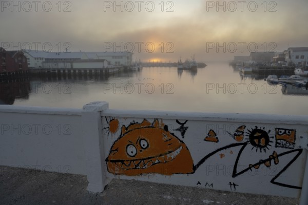 Street art on bridge at the harbor. Vardö street art phenomenon created by the festival Komafest, curated by artist Pøbel in 2012, Vardø, Finnmark, Norway