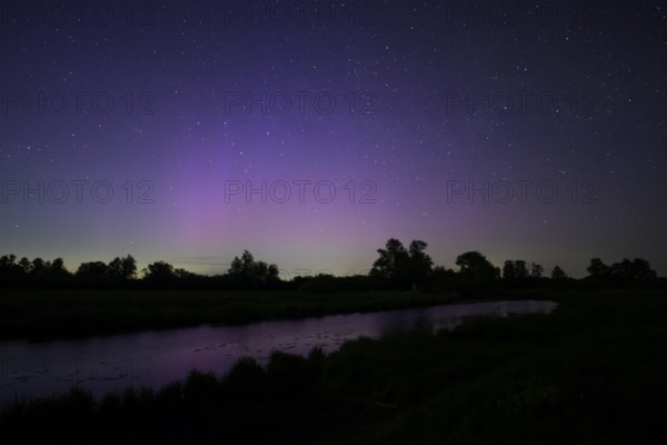 Aurora borealis aurora borealis on the Hunte dyke, Dümmerniederung nature park Park, Lower Saxony, Germany