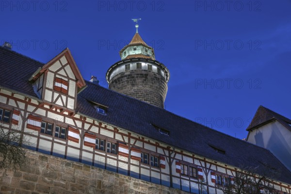 Sinwell Tower built in the 13th century, on the Nuremberg Kaiserburg in the evening lighting, blue evening sky, Mount of Olives, Nuremberg, Middle Franconia, Bavaria, Germany