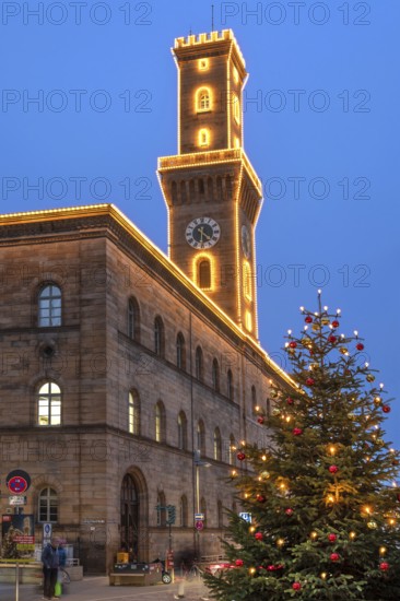 Fürth Town Hall in evening lighting, the tower is imitated the tower of the Palazzo Vecchio in Florence, on the right a decorated Christmas tree, blue evening sky, Fürth, Middle Franconia, Bavaria, Germany