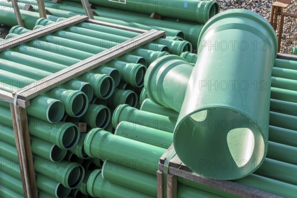 Symbolic picture construction site, sewage pipes for dirty and rainwater, for installation in the ground, plastic pipes, made of polypropylene, storage on a construction site