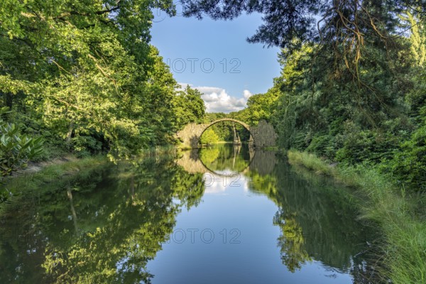 The Rakotz Bridge or Devil's Bridge on Lake Rakotz in the Kromlau Azalea and Rhododendron Park, Upper Lusatia, Gablenz, Saxony, Germany