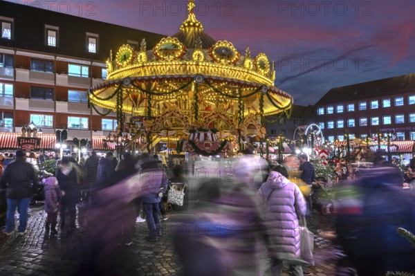 Nostalgic children's carousel at the children's Christmas market in the evening, Hans-Sachs-Platz, Nuremberg, Middle Franconia, Bavaria, Germany