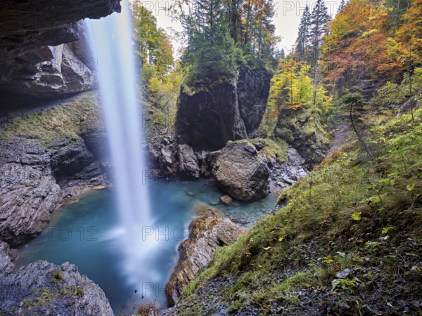Waterfall mountain list in autumn-colored surroundings, Linthal, Klausenpass, Canton of Glarus, Switzerland