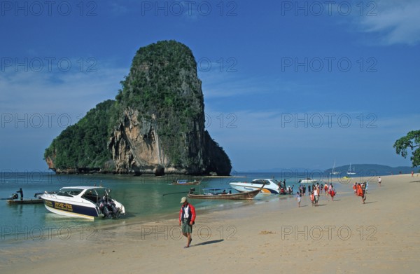 Rocks in the sea, boats and people on Pranang Cave beach, two years in front of the tsunami, Krabi, Thailand, December 2002, vintage, retro, old, historic