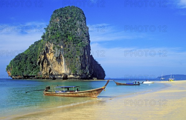Rocks in the sea and longtail boats on Pranang Cave beach, two years in front of the tsunami, Krabi, Thailand, December 2002, vintage, retro, old, historic