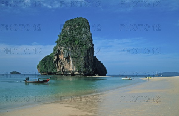 Rocks in the sea and longtail boat on Pranang Cave beach, two years in front of the tsunami, Krabi, Thailand, December 2002, vintage, retro, old, historic