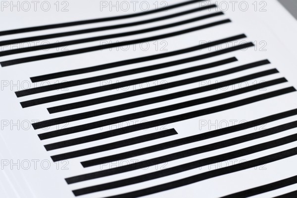 Close up of documents with fully blacked out text. Censorship secrecy and hidden information concept