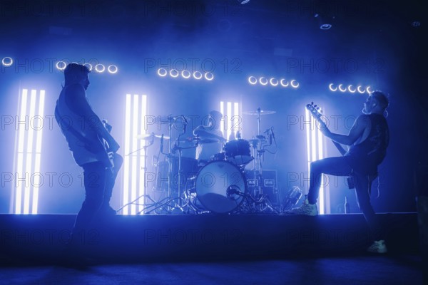 Bass player Chris Wendel, drummer Yuri Cernovolov and guitarist Ramin Tehrani from Engst live on 10-year anniversary tour tour at Berlin's Astra Kulturhaus on 20.12.2025
