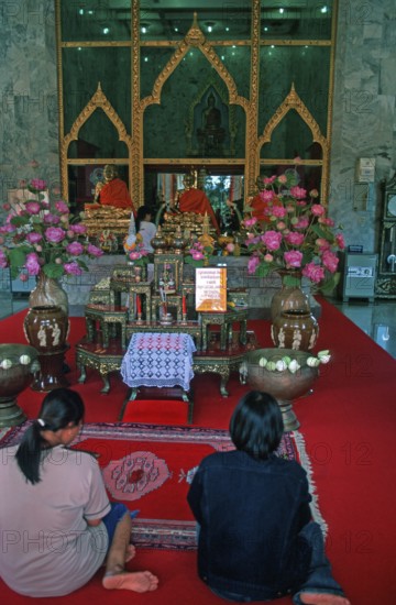 Believers pray at Wat Chalong monastery, Ko Phuket, Thailand, December 2002, vintage, retro, old, historic