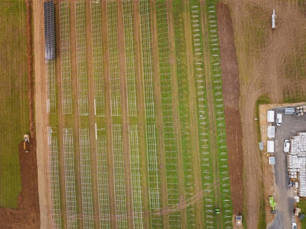 Aerial view of a construction project for solar energy with a cross-field framework, Energiewende, construction of PV open space, Baden-Württemberg, Germany