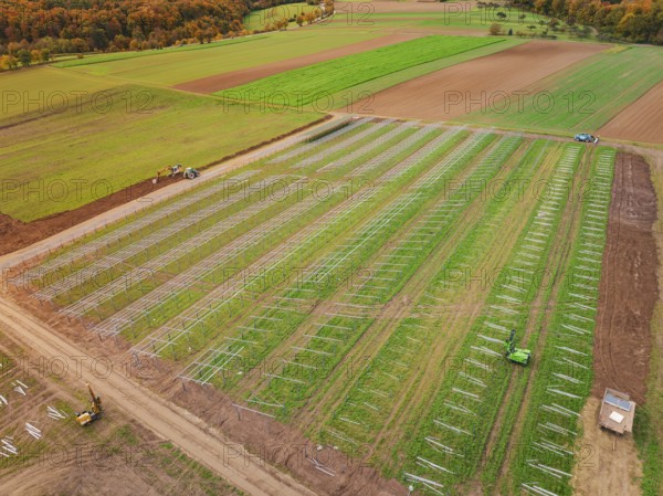 Large-scale field for the construction of a solar plant in autumn, energy revolution, construction of PV open space, Baden-Württemberg, Germany