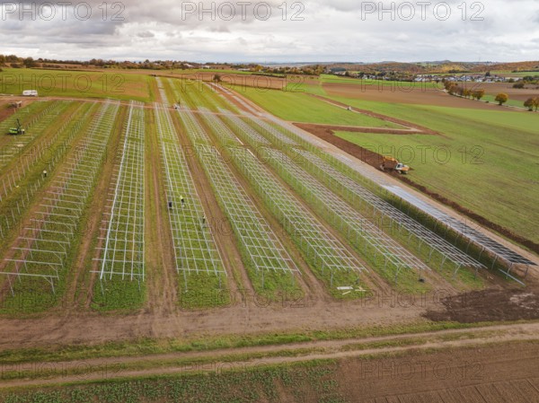 Aerial view of a solar plant under construction on extensive fields, energy transition, construction of PV open space, Baden-Württemberg, Germany