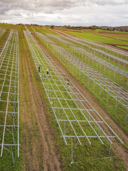 Structures of an incipient solar plant in fields in a rural area, energy transition, construction of PV open space, Baden-Württemberg, Germany