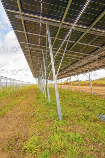 Side view of a large metal structure for solar panels in open countryside, energy revolution, construction of PV open space, Baden-Württemberg, Germany
