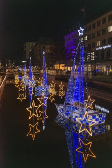 Christmas decoration in Kiel am Holstenfleet, Kleiner Kiel Canal, city center, Christmas, lighting, lights, sailboats, stars, water reflection, shops, evening, darkness, Germany