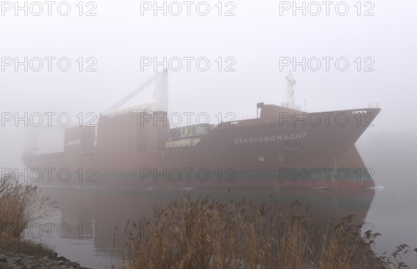 Freighter STADIONGRACHT in fog in the Kiel Canal, NOK, Kielkanal, Kielcanal, Schleswig-Holstein, Germany