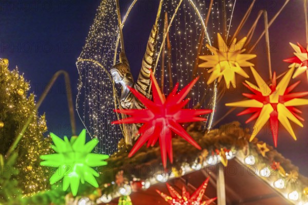 Baroque Christmas market with illuminated angels between the Protestant City Church and the Catholic Church of the Most Holy Trinity. Sights on the market square in the evening. Ludwigsburg, Baden-Württemberg, Germany