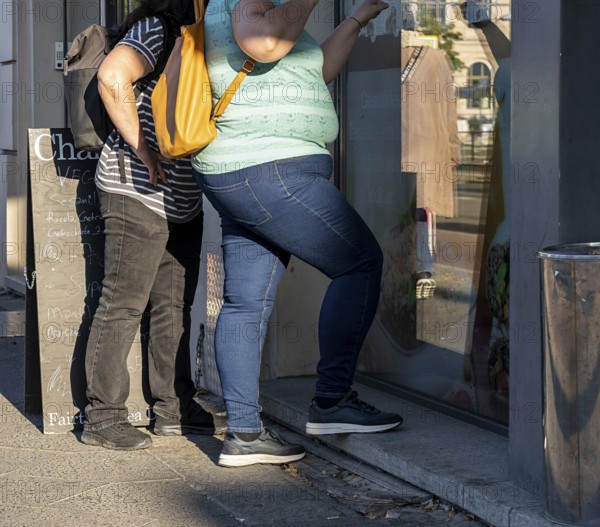 People with obesity stand at an ice cream parlour, Berlin, Germany