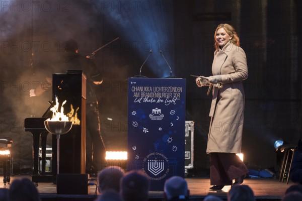 Julia Klöckner (President of the German Bundestag) speaks at the lighting of lights to mark 20 years of Hanukkah in front of the Brandenburg Tor, Berlin, 17 December 2025