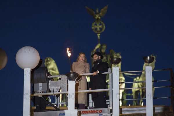Julia Klöckner (President of the German Bundestag) and Rabbi Yehuda Teichtal (Rabbi of the Chabad-Lubavitch movement) at the lighting of lights to mark 20 years of Hanukkah in front of the Brandenburg Tor, Berlin, 17 December 2025