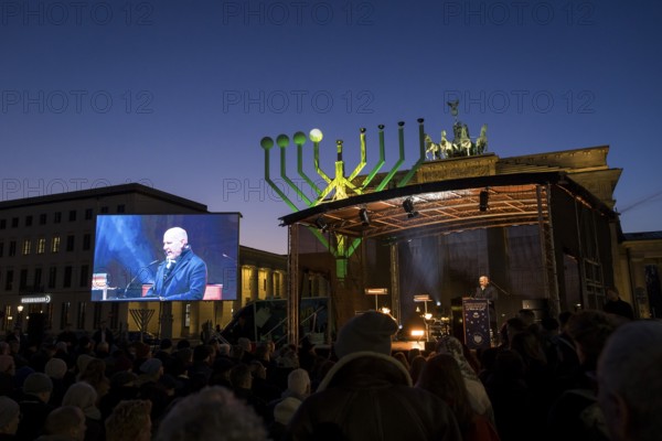 Kai Wegner (Governing Mayor of Berlin) speaks at the lighting of lights to mark 20 years of Hanukkah in front of the Brandenburg Gate, Berlin, 17 December 2025