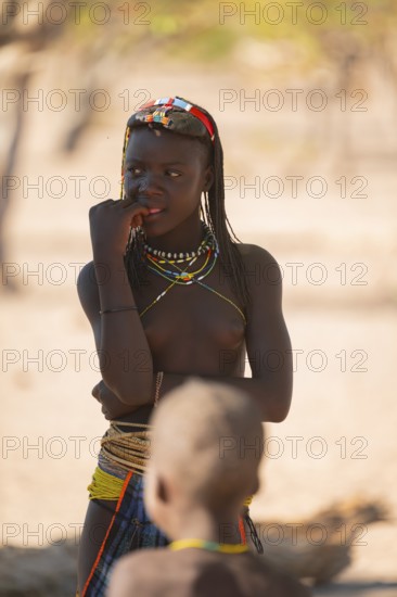 Portrait, brightly decorated girl of the Hakaona tribe, also Havakona or Hakawona, near Opuwo, Kunene, Namibia
