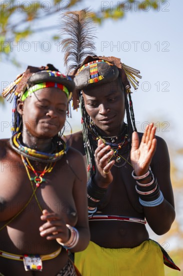 Traditional dance, brightly decorated woman of the Hakaona tribe also dance Havakona or Hakawona, near Opuwo, Kunene, Namibia