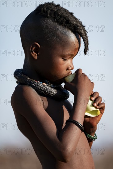 Portrait, young Himba child, traditional Himba village, Kaokoveld, Kunene, Namibia