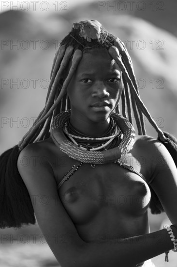 Black and white, young Himba woman with jewelry, portrait, traditional Himba village, Kaokoveld, Kunene, Namibia