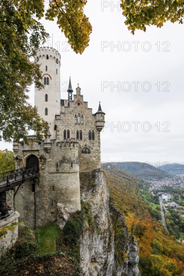 Castle and autumnal forest, Lichtenstein Castle, Honau, Echaz Valley, Swabian Jura, Baden-Württemberg, Germany